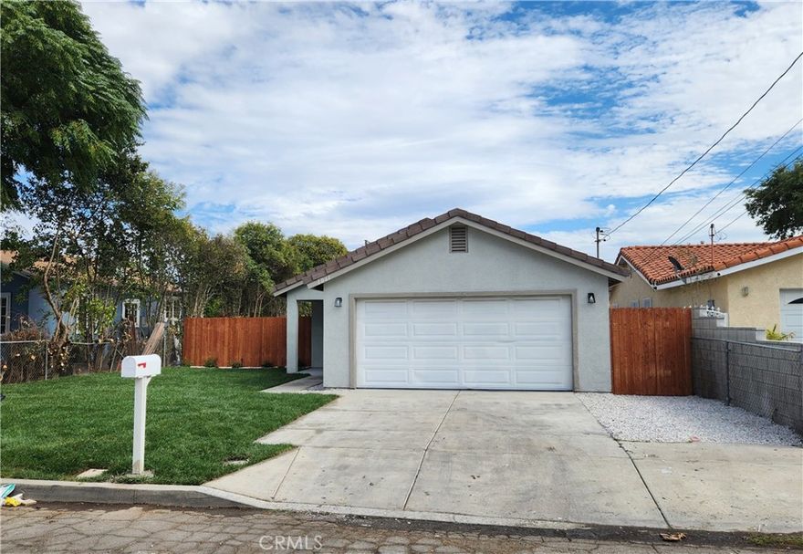 Beautiful Turnkey 4 Bedroom 2 Bath House with Attached 2 Car Garage in San Bernardino. With Direct home access. Exterior and Interior Have Been Completely Remodeled. Exterior Features New Landscaping, New Windows, New Paint, New Garage Door, and Freshly Landscaped Front Yard. Interior features New Paint, New Baseboards, New Panel Doors, New Light Fixtures, Ceiling Fans, and SPC Wood Look Vinyl Flooring Throughout. There are 3 Good Sized Bedrooms with Good Closet Space. There is a Master Bedroom with it's own Full Bathroom and a Walk-In Closet. Bathrooms have been Remodeled with New Tiled Shower / Tub, Toilet, Sink, Fixtures, and Vanity with Quartz Counter Top. Living Room Features Plenty of Space for All your Furniture. Kitchen is Remodeled with New Cabinets, Crown Molding, New Quartz Counter Tops, New Sink, New Range Hood, New Fixtures, Free Standing Stove Oven, Garbage Disposal, and New Dishwasher. House features Central Heat and A/C. House has a Back Yard. Not too far from the 215, 10, and 210 Freeways. There is Shopping and some Dining Nearby. Call Today to Take a Look At this Great Property!