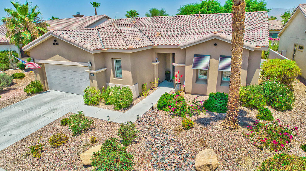 Welcome to your dream oasis in the highly sought-after 55+ Sun City Shadow Hills community! This beautifully UPDATED San Emilo floor plan offers 2-bedrooms, 2-bathrooms and DEN making this home the perfect blend of comfort, style, and functionality.Step inside to discover a stunning kitchen featuring QUARTZ countertops and NEWER APPLIANCES ideal for the home chef. The kitchen even boasts a Culligan Kitchen WATER PURIFIER. The open concept living area has PLANTATION SHUTTERS throughout and is bright and inviting, with UPDATED CELILING FANS in every room to keep you cool year-round. Enjoy peace of mind with a NEWER A/C and HEATING system, complete with a built-in AIR PURIFIER.The spacious master suite boasts a REMODELED SHOWER, offering a spa-like retreat after a long day with a built-in bench. With a HUGE LOT you will have a great space to entertain guests or relax in your private backyard paradise, featuring NEWLY LANDSCAPED GROUNDS, and FRESH EXTERIOR PAINT that enhances the home's curb appeal.Additional highlights include an ALARM SYSTEM, two built-in garage STORAGE RACKS, built in wall Tesla CHARGER and a beautifully maintained community with access to world-class amenities golf courses, clubhouses, fitness centers, pickleball, tennis and more!Don't miss your chance to own this gem in Sun City Shadow Hills--where every day feels like a vacation! Schedule your private tour today!