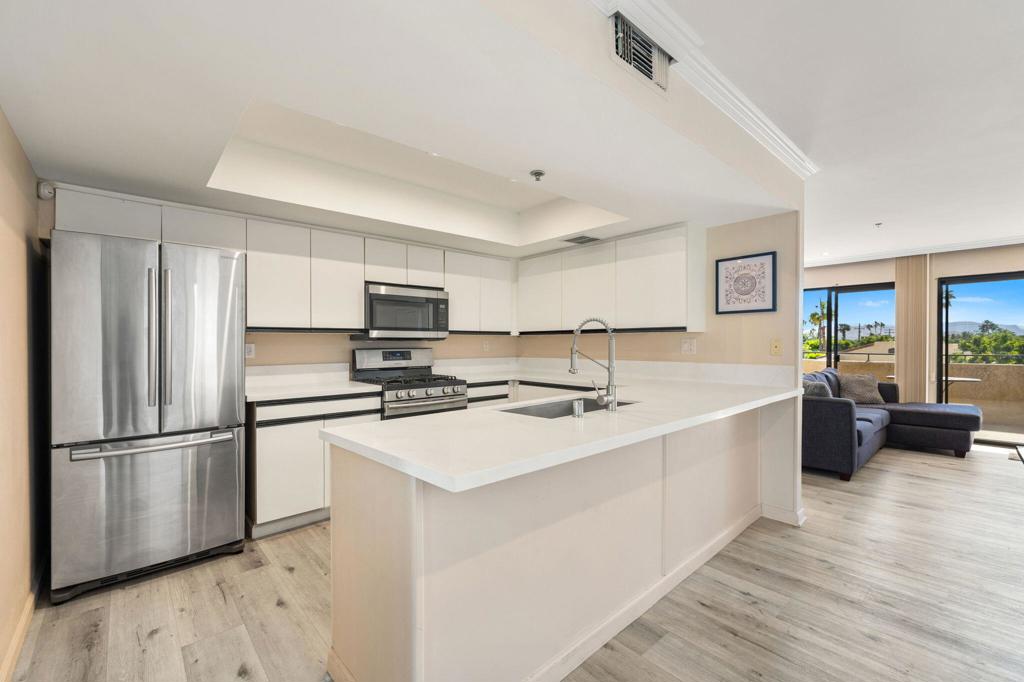 This beautifully updated condo offers stunning views of the surrounding hills and mountains from two private decks. Designed for comfort and style, the home features a spacious kitchen ideal for entertaining, elegant living areas with crown molding and new tile flooring, and remodeled bathrooms with modern finishes. The private primary suite is thoughtfully situated away from common areas, while the second bedroom--also perfect as a den--opens to its own private deck with exceptional views. Additional highlights include a shared garage with one parking space and storage. Conveniently located just minutes from downtown Palm Springs, this home is a must-see--contact us today to schedule a private showing.