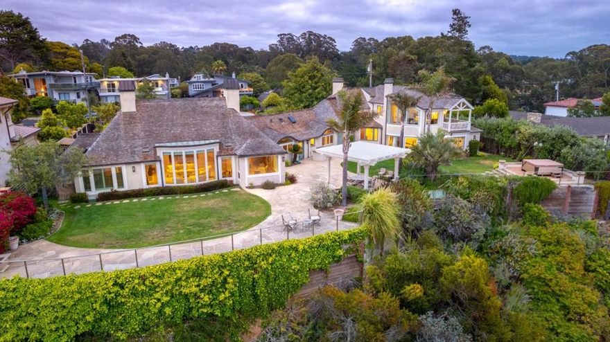 This stunning property is for the selective few. The ones who require the delicate balance of privacy while still entertaining friends & family -The ones who understand that you dont just move to Rio del Mar, you acquire it! The lifestyle begins as you enter this gated estate & the unique architecture welcomes you home each day. This house is situated on the bluffs of Rio del Mar, showcasing the dramatic views of the Monterey Bay coastline. The beautiful kitchen has an amazing amount of counter space and a large island as it flows into the living room, displaying 1 of 4 spectacular fireplaces. This striking home also boasts a game room, fully equipped fitness room and steam bath. The entire second floor is a retreat that is set aside specifically for you. Begin each day with a cup of coffee on your private balcony while taking in the view & end each day under the stars.  The fireplace solidifies the perfection of this room; but its the walk-in closet that will leave you breathless.