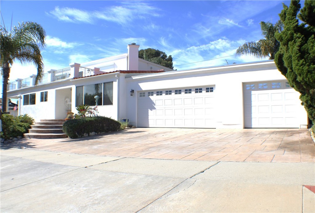 This VIEW home truly has it all! From the moment you pull up, you’ll notice the amazing curb appeal, a spacious three-car garage, and over 3,300 sq. ft. of thoughtfully designed living spaces. The floor plan flows beautifully throughout, and the property sits on a large, private lot with panoramic ocean, Catalina, and coastline VIEWS from every upstairs room. Lovingly cared for and cherished for decades, this 4-bedroom and beautifully appointed 5 bath home welcomes you with a dramatic formal living room featuring a massive fireplace. The oversized dining room is perfect for hosting gatherings, while the upgraded kitchen shines with custom cabinetry, lovely garden window and stainless steel appliances. With two primary suites — one upstairs and one downstairs this home offers flexibility and comfort for all lifestyles. Upstairs, a huge family room and primary suite open to a large patio, where you can soak in breathtaking views. Step outside into the lush backyard, complete with manicured landscaping, perfect lawn, beautiful garden, and plenty of privacy. This is more than a home it’s a retreat. Close to award winning PV schools, endless ocean trails and easy access to the city and major roads.