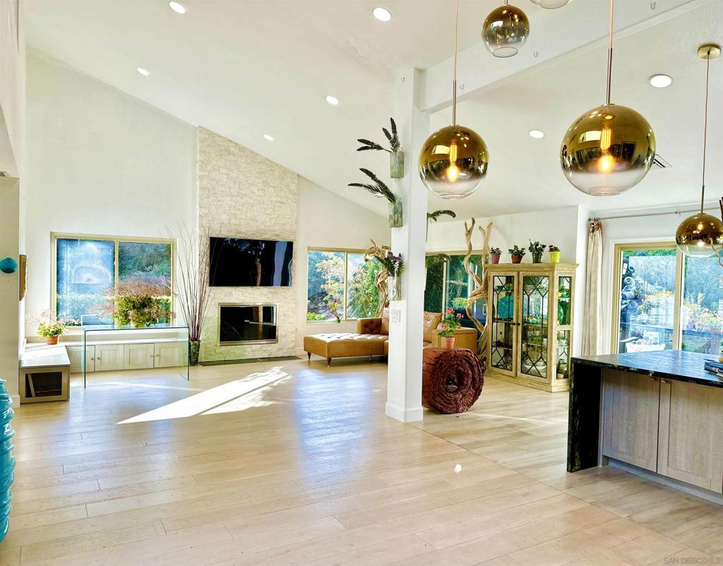 A Hidden Garden Home with Soul – Family-Friendly & Artist-Inspired in La Jolla Alta II Step into a serene 4-bedroom, 2-bath home where every window frames sunlit greenery, open skies, and calming breezes. Tucked in a peaceful corner of La Jolla Alta II, this 2,428 sq ft single-level home blends nature, privacy, and inspiration—perfect for families and creatives alike. The home backs directly onto a wide tree-lined greenbelt that feels like a private park. With no fence to interrupt the flow, the yard and open lawn merge into one tranquil retreat, ideal for kids to explore or for relaxing beneath the trees. Its end-unit location offers rare privacy, with generous space between neighbors for true peace. Inside, skylights and large windows fill the modern, open layout with natural light. The living room features soaring ceilings and a sleek fireplace, while the kitchen offers black granite counters, custom cabinetry, and a picture window framing the outdoors. The spacious primary suite includes dual closets and a spa-like bath with soaking tub, walk-in shower, and double vanities. A versatile loft can serve as an art studio, office, playroom, or guest area. Community perks include pools, hot tubs, tennis courts, gym, clubhouse, and sauna, all just minutes from La Jolla beaches and top-rated schools. This is more than a home—it’s a place to grow, create, and breathe. Renter pays all utilities.