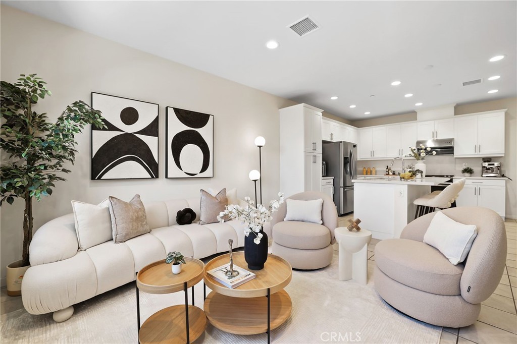 Welcome to this exquisite tri-level condo in the prestigious gated community of IronRidge in Portola Hills. This beautiful home boasts 2322 sq feet of living space, 4 bedrooms, 3.5 baths, 2 car attached garage. On the first floor, you'll be greeted by an open floor plan that seamlessly connects the family room, kitchen, and dining area. The contemporary kitchen boasts white cabinets, a large island with bar-height counter seating, quartz countertops, stainless steel appliances, making it a chef’s dream. The second level offers 3 bedrooms as well as 2 full bathrooms, a laundry room for your added convenience. The primary ensuite boasts double sinks with ample cabinet space, a walk-in shower, and a spacious walk-in closet. The Third level is designed for ultimate comfort and flexibility, with a versatile loft space ideal for a home office, theater, or easily converted into a fifth bedroom. This level also includes a guest bedroom, guest bathroom. Additionally, a large city park just outside the gates offers the perfect setting for evening sunsets, dog walks, or pickleball matches. With the majestic backdrop of Saddleback Mountain and proximity to top-rated schools, such as Portola Hills Elementary, this community provides a serene environment for relaxation, growth, and outdoor recreation. Enjoy the security and convenience of living within the gated community of IronRidge, complete with no Mello-Roos and a low tax rate. Don't let this opportunity slip away. MUST SEE!