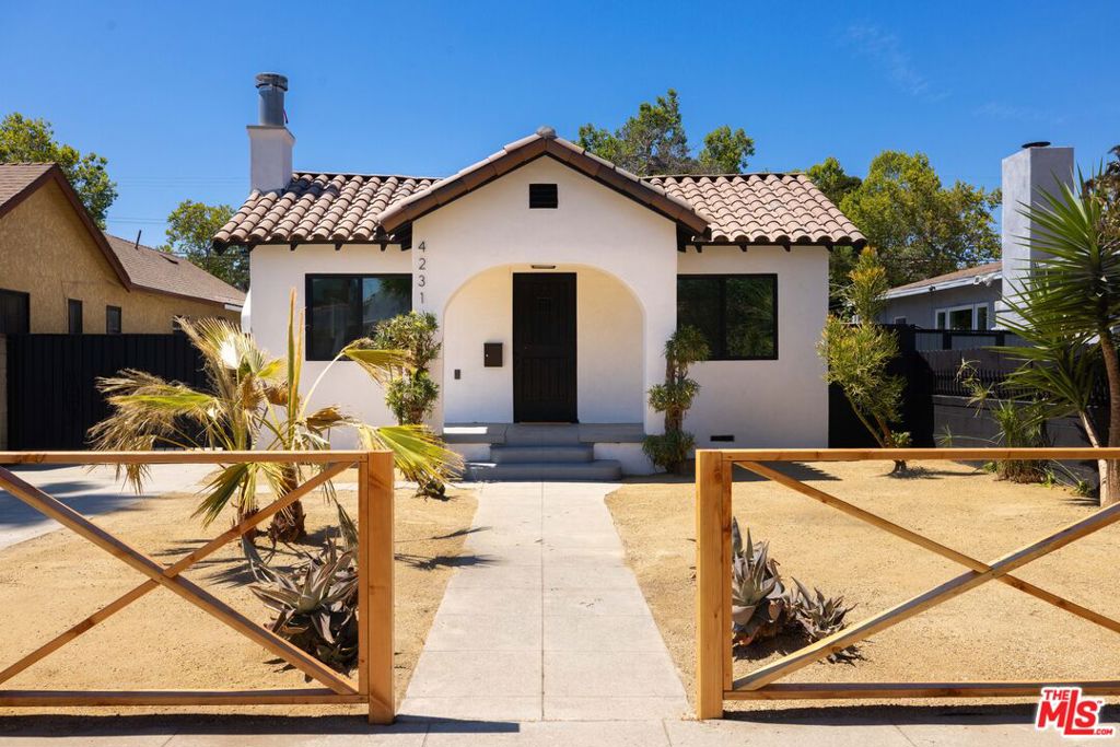 On a picturesque street, lined with towering palm trees, in historic Leimert Park, an assuming California Bungalow has undergone a complete metamorphosis--emerging as QUIMERA, an enigmatic Spanish Bungalow that blends captivating character with modern comforts and eclectic design. The result is a hybrid of styles and a fusion of forms worthy of its name. Brilliantly reimagined, this home offers 3 bedrooms + 1.75 baths, along with a finished 250 sq ft detached Bonus Studio, ready to easily adapt to a myriad of needs--as a creative studio, home office, or versatile rec space. Beyond the interiors, a generous backyard framed by shady trees and lush greenery invites you to relax, entertain, and recharge in your own private retreat.