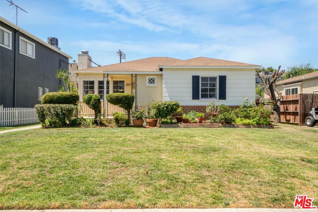 This well-maintained 1940s 3-bedroom, 1-bath home offers timeless character and a rare oversized lot in one of West LA's most desirable neighborhoods. With 1,134 sq ft of living space on a generous 6,239 sq ft lot, this single-story gem is ideal for homeowners looking to move right in - or expand as they grow. Builders and developers will appreciate the prime location and strong potential for a standout future home, just one block from Santa Monica. Set on a quiet, tree-lined street with charming curb appeal, the home features beautiful natural light, hardwood floors, and a thoughtful layout with great ventilation. The kitchen and bath have been refreshed over the years from their original 1940s design, offering functionality with room for future personalization. The bathroom includes both a separate tub and shower. The detached two-car garage, accessible via the alley, offers extra utility and is a fantastic candidate for an ADU - adding flexibility, value, or future rental potential. Meanwhile, the fenced backyard, lined with mature fruit trees, provides space, privacy, and potential. Located in a welcoming, well-established neighborhood with many long-time homeowners, the property is just three miles from the beach and minutes from parks, libraries, shops, restaurants, and major freeways (10 & 405). It's central, convenient, and ready for its next chapter. Whether you're an owner-user or a builder with vision, this Westside classic delivers location, lot size, and livability - all in one inviting package.