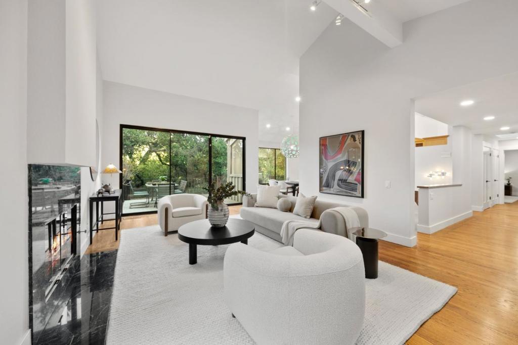 Escape to serenity in this very private 4-bedroom, 3.5-bathroom retreat priced at $3,599,000. Spanning 3,470 square feet on a 25,966 SF lot, this 1988-built residence blends timeless elegance with modern sophistication. The light-filled interior boasts soaring ceilings, large windows, new paint, and lighting throughout, creating an inviting open-concept layout ideal for both grand entertaining and tranquil living. A gourmet kitchen, featuring stainless steel appliances flows seamlessly into spacious living and dining areas. The private primary suite offers a luxurious, spa-inspired ensuite, creating a serene haven. Outside, the beautifully landscaped lot, enveloped by Portola Valley's iconic oaks, provides a secluded oasis for relaxation or outdoor gatherings. Enjoy an excellent community of neighbors and access to top-rated schools, including Ormondale Elementary, Corte Madera Middle, and Woodside High School (buyer to verify eligibility). Perfectly positioned to get away from the lights of the city while remaining close to Silicon Valley's tech hubs, scenic trails, and Roberts Market, this home offers unmatched privacy and convenience. Seize this rare opportunity to own a slice of Portola Valleys idyllic lifestyle!