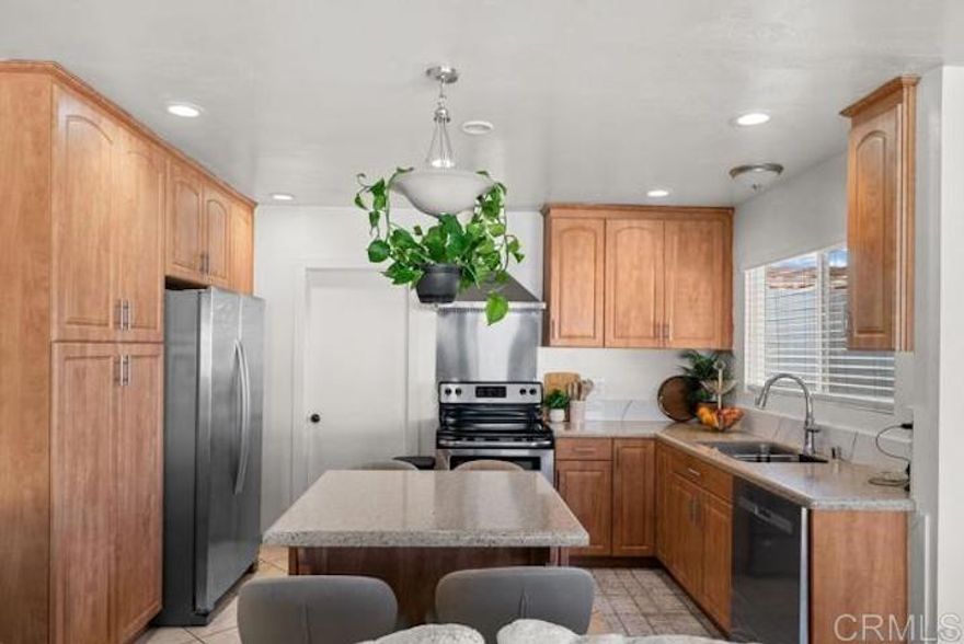 This well-maintained and clean unit offers a spacious 3 bedrooms 2 bathrooms with a oversized private backyard and one car garage with washer and dryer provided. Unit has been recently upgraded with modern finishes, including new kitchen, new countertops and sleek stainless steel appliances. Tile floors in kitchen and bathrooms and laminate throughout the rest of the unit. Each room has its own mini split-unit AC. The property also boasts a beautifully maintained backyard with concrete and artificial turf, perfect for outdoor gatherings or relaxation. Plenty of additional parking, and is close to freeways and shopping.