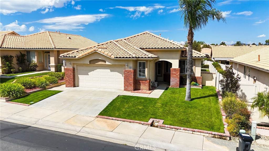 PRICED TO SELL 'FORSYTHIA' Model (SINGLE LEVEL 2 BR + 2 BA + Office/Den - 1,668 Sq Ft) with NEWER HVAC. Brick Enhanced Exterior with Nice Curbside Appeal - Enter the Home to a Dedicated Foyer Interior Entry with Decorator Cut Outs - a Den/Office is to the left of the Entry, and Arched Doorways lead to a Great Room. The Great room is Light and Bright, with Plantation Shutters, Coffered Ceilings, a Cozy Fireplace, and Sliding Doors to the Patio/Yard Area. The Kitchen is Open, with SS Appliances, including Refrigerator. Laundry Room is off Kitchen - Washer, Dryer & Refrigerator are all included in the Price. The yard is Fully Fenced with a new Alumawood Patio Cover running the length of the Home, and there's a lovely view of the San Gorgonio Mountains over the fence ....... Sun Lakes Country Club goes beyond just a place to live - It's a vibrant community designed to keep you Active & Engaged, offering: TWO 18-HOLE GOLF COURSES with 2 Pro Shops, THREE Clubhouses, TWO Restaurants, Bar & Lounge, Tennis, PICKLE BALL COURTS, Pools (Including Large Indoor Pool), Jacuzzi Spas, THREE Fitness Centers & Fabulous Planned Activities Offered on a Daily Basis. There are 80+ Social CLUBS, including: Dancing, RV Club, Yoga, Table Tennis, Cards, Bocce Ball, Bowling, Car Club, Drama/Theatre Club, Sewing, Tennis, Knitting, Bingo, Travel, Quilters, Art League, International Culture, Genealogical Society, Garden, Photography, Travel, and a lot MORE .... If that's not Enough, Add TRIPS AND TRAVEL EXCURSIONS scheduled all year long. Association Dues INCLUDE CABLE TV & INTERNET - The community is Located Close to Casinos, World Famous Shopping (Cabazon and Palm Springs), Restaurants, and Excellent Medical Facilities - SUN LAKES COUNTRY CLUB is has a backdrop of two Mountain ranges, which offer stunning views - LIFE IS GOOD in our Awesome Community!