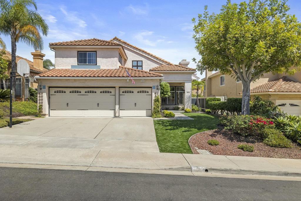 Welcome to this inviting home in the highly sought-after Park Village community. A bright and open floor plan with vaulted ceilings and large windows creates a welcoming atmosphere filled with natural light. The main level includes a full bath and versatile office or flex room, perfect for guests or working from home. The kitchen features granite counters, stainless steel appliances, rich wood cabinetry, and greenhouse windows looking out to the backyard. Upstairs, spacious bedrooms provide comfort and privacy, while the primary suite is a true retreat with a step-in shower, soaking tub, dual vanities, and a walk-in closet. The living areas are designed for both everyday living and entertaining, with a cozy fireplace and seamless flow between spaces. Step outside to a private backyard oasis with multiple seating areas, mature landscaping, and plenty of space to relax or host gatherings. A built-in BBQ makes outdoor dining and entertaining easy, while lush greenery and shade from mature trees create a tranquil setting. Additional highlights include owned solar for energy efficiency, and a three-car garage. Park Village is known for its welcoming community feel, nearby trails and open space, top-rated Poway Unified schools, and convenient access to shopping, dining, and freeways. Experience the perfect balance of comfort, convenience, and the vibrant lifestyle that makes Park Village so desirable.