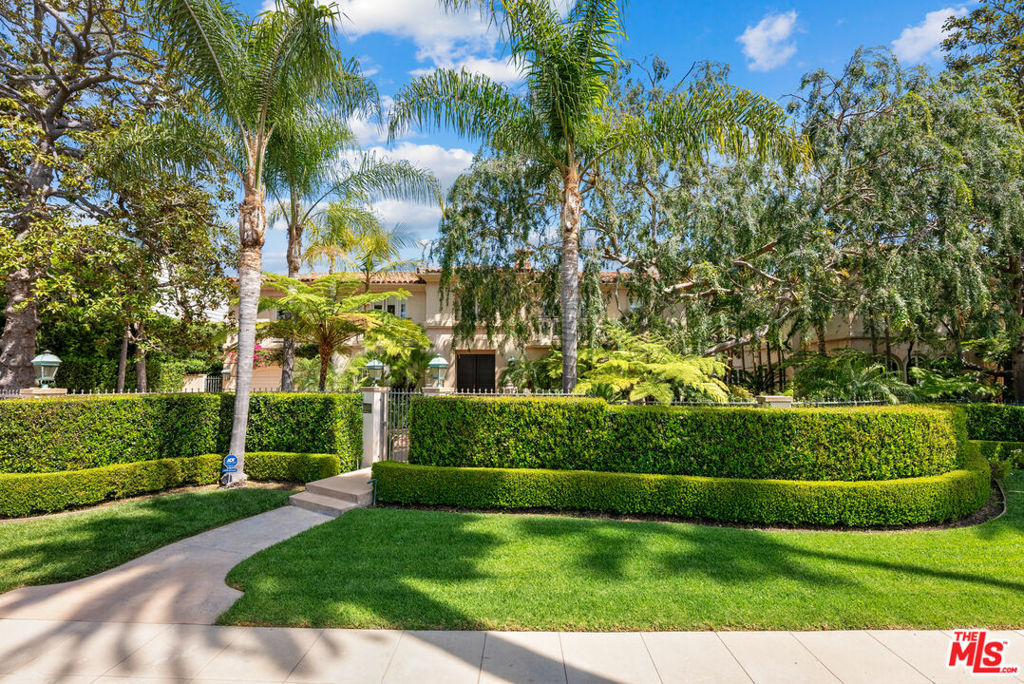 Newer beautiful Mediterranean gated estate on one of the best streets in the Beverly Hills Flats. Private from the street, high ceilings, 4 bedrooms ensuite up and one ensuite bedroom down. Lovely living room and dining/kitchen, 2 2-car garages and a full-size championship lighted tennis court on a half-acre of land. There's a stunning full-size chefs outdoor kitchen. This property was built as the "guest house for 812 N Bedford". The square footage is approximately 4100 sf (see floorplan). House can easily be expanded and tennis court can be altered into a sports court to create an amazing back yard. There are endless possibilities! *812 and 814 N Bedford can be sold as a "compound".