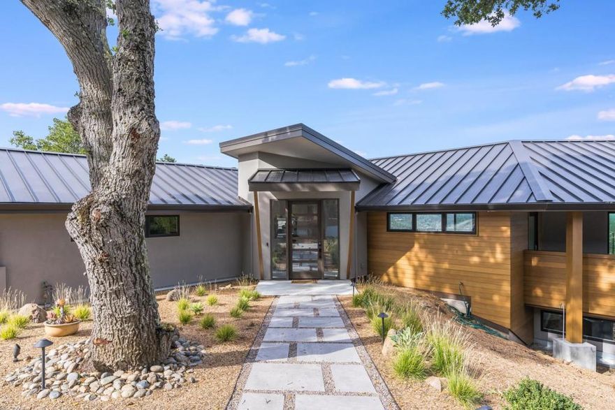 Modern Oasis with spectacular expansive views of the mountains and Silicon Valley, this luxury custom-built home is located on a gated private road mere minutes from downtown Los Gatos. The glistening pool with waterfall fountain and outdoor kitchen is just the introduction you will need to this entertainers paradise.  The light filled open concept main level boasts a Chefs kitchen with pass through window for bar style seating, contemporary vaulted ceilings in the living/dining areas and floor to ceiling accordion doors create a perfect frame for the large deck which wraps around to a covered outdoor kitchen with Lynx grill and TV lounge. Exquisite views and decks accompany four bedrooms with ensuite bathrooms, an additional bedroom/office adjoins the master suite. Lower level family/media/game area is a fabulous spot to just unwind. and make sure to take a look at the perfect space for your wine cellar or music/art studio. This stunning property is more than a home, it's a lifestyle.