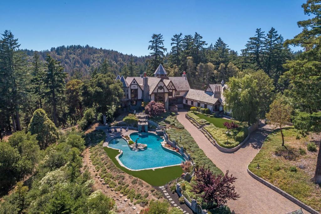 One of the most extraordinary properties on the SF Peninsula on almost 18 acres. The property has endless potential (including zoning for commercial use) and has been used to raise horses, to showcase a car aficionados collection, and to host philanthropic and social events easily up to 200 guests, all the while serving as a comfortable venue for everyday living. 5-floor main residence from the 10+ car garage to a viewing room at the top of one of the turrets. Personal quarters include multiple apartments plus tremendous, dedicated office space. The barn is a matching masterpiece with both buildings hand-crafted by local and international artisans with individual details taking up to a year to complete. Magnificent grounds include a 4-tee golf practice area, RC car track, resort-inspired pool and spa, and direct access to miles and miles of hiking and equestrian trails in bordering Wunderlich Park. Woodside or PV schools. 17 minutes to Woodside town center.