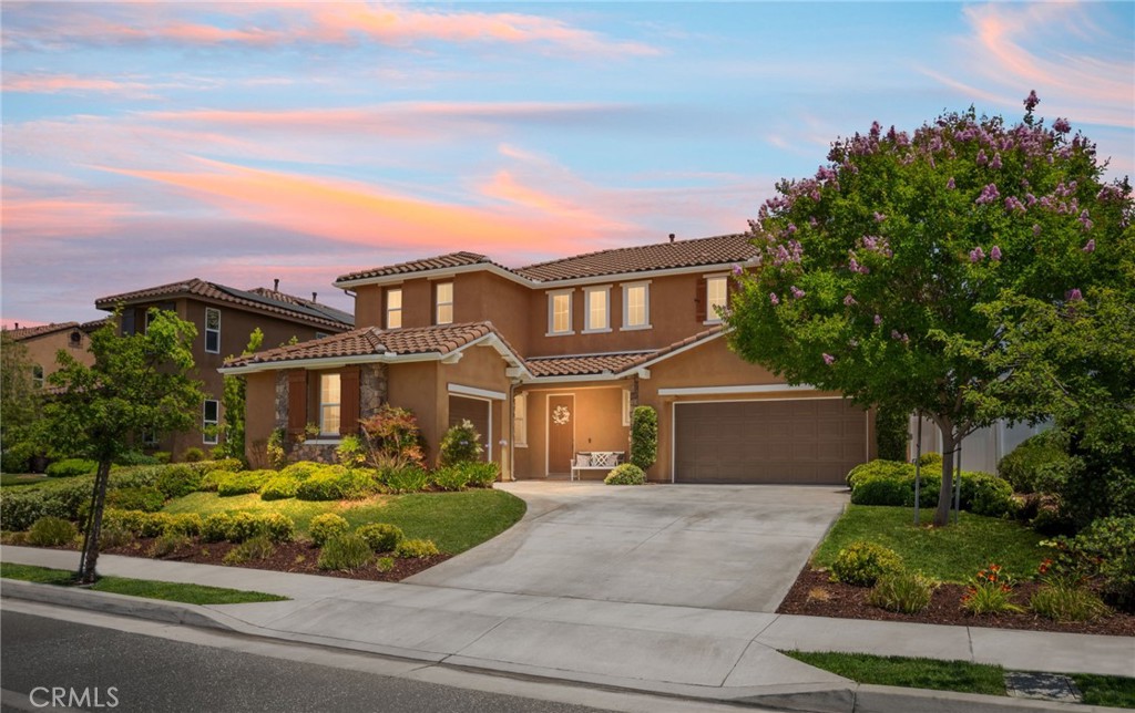 Rare find! Patterson Ranch, intimate gated community home with all the conveniences of modern living. Three garage spaces - one double, and one single for your third car, storage, or a workshop. A modern formal entryway greets you into the home. Adjacent to that is a living space complete with formal dining. A pass through will take you to the modern white kitchen complete with coffee nook and enormous walk in pantry. Great for entertaining, the kitchen opens up to a large Family Room with mounted, framed entertainment system tucked into the hidden wall access, just over the gas fireplace. Gather around the TV for movie night and enjoy the built multi-room audio system, which is pre-wired to the speakers in the living room and master bedroom - also great for playing music throughout the house! Lower level guest suite offers comfort for all visitors complete with a full bathroom. Upstairs holds three more well curated bedrooms, all complete with walk-in closets and a full bathroom, as well as an enormous primary suite. The sizable primary bathroom has a soaking tub, walk-in shower, his and her sinks, and large walk in closet with added shelving and storage. In the backyard, a large covered patio is great for hosting summer get togethers. Enjoy fresh picked fruit from the garden with apple, pear, and peach trees. Conveniently located near Judson and Brown Elementary School, the Redlands Sports Complex, Soffel Farms, Hanger 24 Brewery, and more. Excellent Redlands schools.