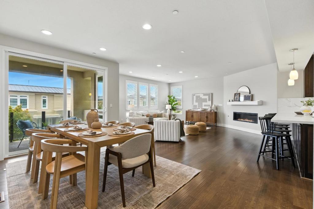 Gorgeous, light-filled condo built in 2018 featuring 2 bedrooms, an office/den, and 2.5 bathrooms. The open-concept layout offers modern living with a seamless flow between the kitchen, dining, and living areas. A private patio off the main living space offers a peek at the Bay Bridge and the bay. The spacious primary suite is a true retreat, complete with two walk-in closets and a luxurious ensuite bathroom with double sinks, a soaking tub, and a walk-in shower. Enjoy partial views of the San Francisco skyline and the bay from the primary suite. The second bedroom also features its own private en-suite bathroom. The den/office is ideal for guests or a comfortable work-from-home setup. Additional highlights include a rare 3-car attached garage w/electric car hookup and in-unit laundry room. The community offers beautifully landscaped grounds, a BBQ area, and is just steps from the scenic Ferry Point Loop Trail, Parks and hiking trails. The surrounding Point Richmond neighborhood features charming cafes, restaurants, a new indoor pickleball center, and convenient ferry access to San Francisco. Modern comfort, thoughtful design, and a vibrant bayfront setting all in one.