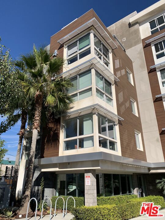 Stylish coastal living meets modern luxury at the exclusive X67 Lofts in the Marina Del Rey Arts District. This light-filled 5th-floor corner residence offers an open chef's kitchen with Caesarstone island, premium stainless steel appliances, custom cabinetry, and in-unit washer/dryer. The spacious private balcony extends from both the living area and the primary suite, which features an oversized walk-in closet and spa-inspired bath with dual vanities. Floor-to-ceiling windows with motorized blinds showcase city views. Second bedroom with its own bath and nice size closet, Central Heating and Cooling, with two gated parking spaces.Enjoy full-service amenities including concierge, designer-furnished lobby, coffee lounge, fitness center, recreation room, pool, and landscaped courtyard with modern seating and BBQs. Steps from trendy cafe's, fine dining, and theaters. Available after Sep 15, 2025