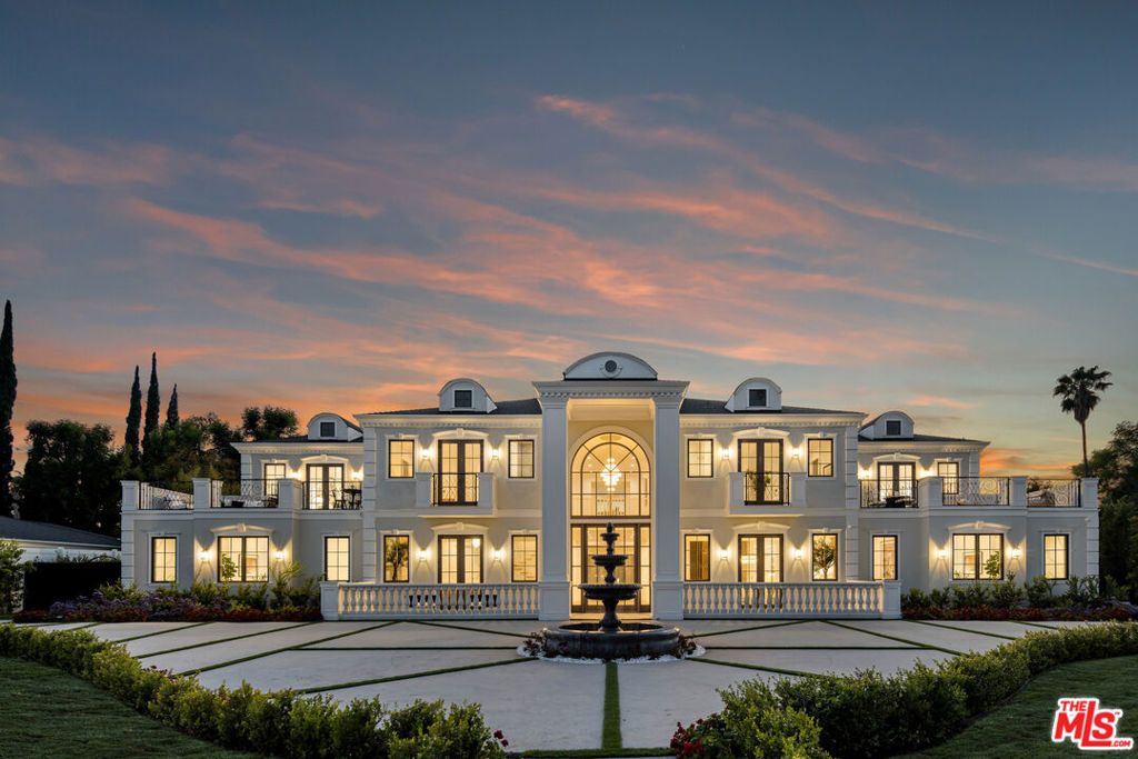 Situated in the prestigious enclave of Amestoy Estates, this exceptional new construction offers a rare blend of grand scale, refined detail, and resort-style amenities. Set on an expansive 39,064 square foot lot, the home spans over 9,835 square feet of living space and was thoughtfully designed for those who value both elegance and ease. Beyond the impressive entry doors, natural light pours into a seamless open floor plan that flows effortlessly between sophisticated formal spaces and intimate living areas. The formal living room with fireplace and the elegant dining room with wine display both open to private patios, setting the tone for memorable indoor-outdoor entertaining.The heart of the home is a chef's dream kitchen, appointed with top-of-the-line appliances, two oversized islands, custom cabinetry, stunning quartz counters, and a walk-in butler's pantry. It opens to a warm and inviting family room with built-ins, fireplace, and massive sliding glass doors that retract to connect you to the outdoor living spaces.A richly appointed billiard and entertainment room, private theater, fully equipped gym with sauna, elegant powder room, secluded home office, and a spacious ensuite guest bedroom / maid's quarters complete the main level. Upstairs, the primary suite offers a true retreat with a private sitting area, dual-sided fireplace, two walk-in closets, and a luxurious spa-like bath with soaking tub and oversized shower. Enjoy serene views from the private balcony and access to an additional shared patio. Four more ensuite bedrooms, each with their own oversized patios, and a large laundry room complete the upper level.The estate includes a thoughtfully designed one-bedroom plus office, one-bathroom guest house / ADU with its own address at 5135 Louise Avenueideal for extended stays, a private workspace, or potential rental income. The outdoor grounds evoke a true resort lifestyle, featuring a sparkling pool and spa, outdoor fireplace, built-in BBQ with island, a private basketball court, golf putting green, and beautifully manicured landscaping. Ideally located just moments from Ventura Boulevard's finest dining, shopping, and entertainment, this extraordinary estate offers unmatched space, amenities, and lifestyle in one of Encino's most coveted neighborhoods. Welcome to a new standard of luxury living!