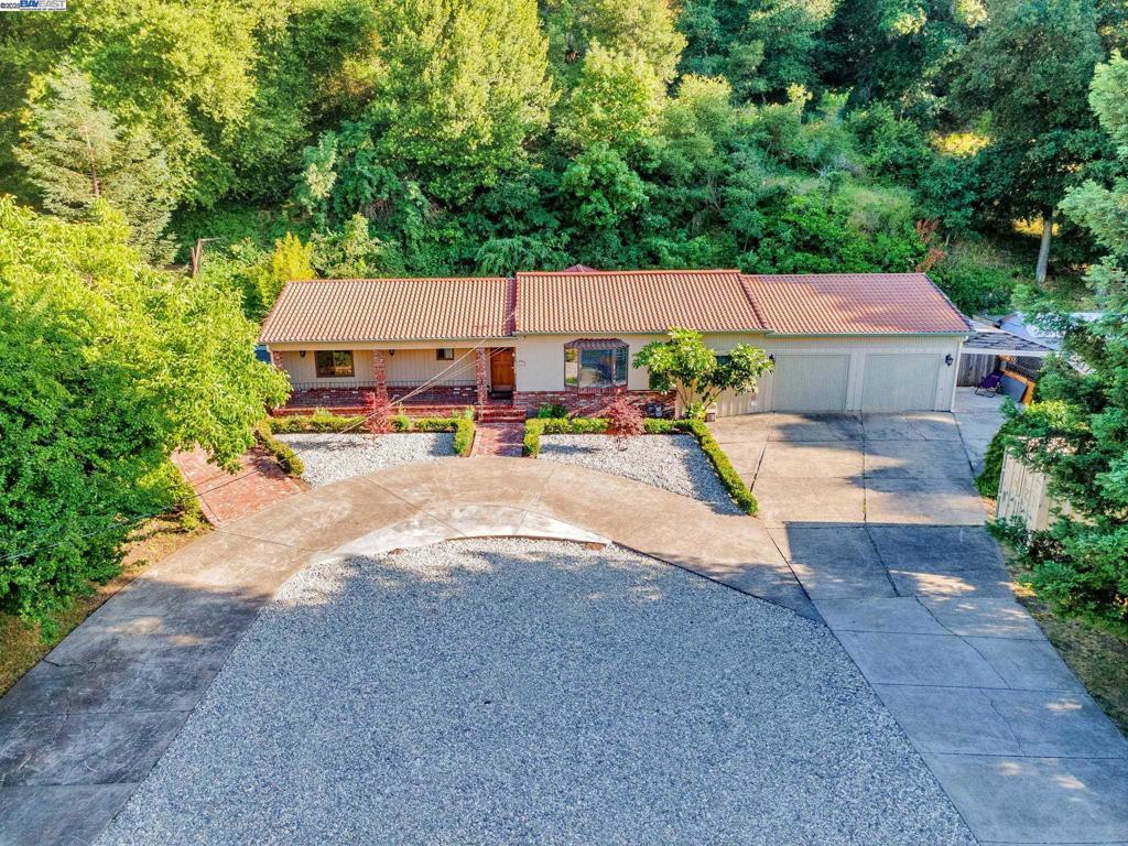 4-Day Price Drop – Save $100K! ?? Stunning Vintage Estate with Private Vertical Garden & Direct Park Access – Welcome to Sucori Country Estate in Pinole Valley! This beautifully upgraded split-level 5-bedroom, 3-bath home on 1.73 acres (75,359 sq ft) backs directly into serene Pinole Regional Park, offering unmatched privacy and nature access. Designed for multi-generational living, it features: Master Guest Suite with private full bath Bonus Master Studio Suite (converted garage) with kitchenette, jetted tub, walk-in shower, AC/heating combo, and private entrance The estate’s crown jewel is its tranquil vertical garden—a lush, private oasis leading to your own hiking trail and scenic vista point. Upgrades & Amenities: Andersen windows, ceiling fans, AC wall units, crescent-shaped driveway, and ample parking for entertaining. Prime Location: Walk to soccer & baseball fields, swim center, skateboard park, playground, and the newly renovated Pinole Valley High School. Minutes to Trader Joe’s, Sprouts, and Pear Street Bistro. Don’t miss this rare opportunity — $100K off!