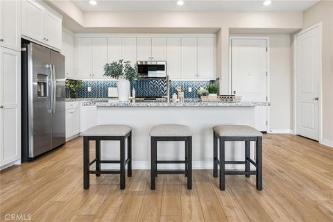 Photo of 27466 Mercantile Court #205, Valencia, CA 91381 (MLS # SR26071797)