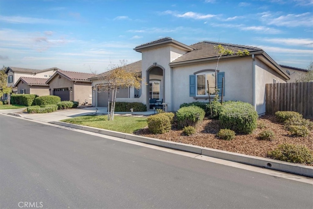 Welcome to this beautiful 3 bedroom 2 bath single story home in the desirable Heritage Square Community. As you enter the home, you will quickly appreciate the wide open floor plan and thoughtful, designer touches throughout. The open concept floorpan flows beautifully from the living area to the kitchen and family room. Enjoy the ambiance of the fireplace as you prepare a meal in the chef inspired kitchen or just sit and relax at the granite countered kitchen island. Off the kitchen is an indoor laundry room.The primary bedroom is located towards the back of the home offering exceptional privacy while the 2 additional bedrooms and bath are towards the front. The backyard offers privacy and low maintenance landscaping and lots of hardscape for easy entertaining and cleanup. The community offers lots of amenities you are sure to enjoy. Don't mis this opportunity. This home is sure to go fast.
