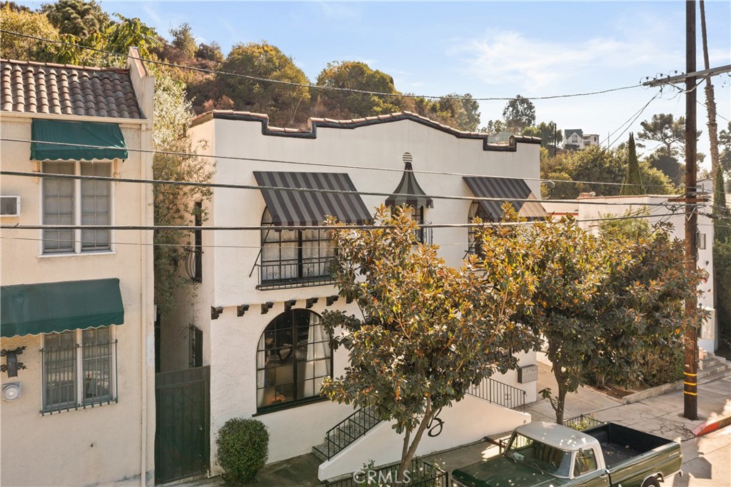 Prime Income Property on N. Beachwood Drive | Steps from the Hollywood Sign
Rare chance to own on one of LA’s most coveted streets! This unique property features two buildings on the same parcel with a shared driveway and five one-car garages with storage. The front building, vintage four updated 1-bedroom, 1-bath units of approximately 1,000 sq. ft. each, complete with hardwood floors, in-unit washer/dryers, and private entrances. These units are in high demand with a history of NO VACANCIES often renting before they even hit the market. Behind it sits a spacious two-story, 2-bedroom, 1-bath home of about 2,200 sq. ft., featuring a basement with laundry, a side enclosed patio, a rear patio with hillside steps, and a private path leading to sweeping views of the iconic Hollywood Sign. Always fully occupied, this property has historic charm, strong rental demand, and Beachwood Canyon location. Tenant occupied and do not disturb tenants. Drive by only.