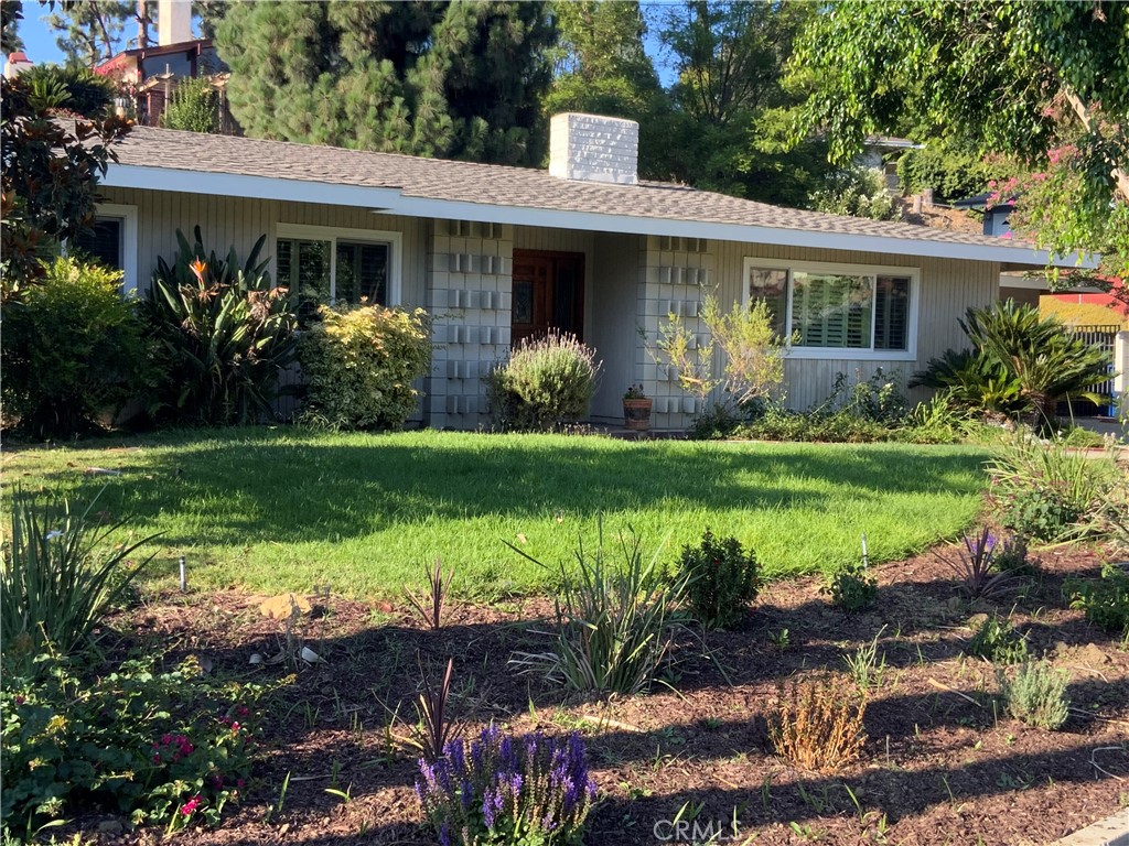 This beautiful single-level four bedroom home is located at the end of a very quiet cul-de-sac in the Sunset Hills subdivision. This home has had only one owner for 63 years. The neighborhood is comprised of all single level homes. The property has a very large beautifully landscaped 13,142 sqft lot that is a gardener’s paradise. There are mature trees and many blooming plants that attract Hunninbirds and other pollinators. There is a very large 60+ year old Canary Island Pine in the rear yard. There are three large gorgeous Jacaranda trees that bloom in June of each year. The landscaped hill in the rear yard provides great privacy as well as color in the Spring when it blooms. The covered patio is great for entertaining or relaxing with a view of the beautiful rear yard. About a third of the rear yard is separated by a fence. This separated area with grass has many possible uses: it can be used as a children’s yard (there is still a Tetherball pole from the days of young kids), a dog’s yard, for raised-bed gardening, a rose garden, or maybe an area to build an ADU (a granny flat). The windows in the home are newer energy efficient dual-paned windows. The large living room has enough space for a grand piano. The kitchen and dining room offers tremendous amount of cabinet storage. The kitchen has a double oven with convection, a new gas cooktop, and a new dishwasher. One bedroom has been used as a home office and has a built-in desk, cabinets, and book shelves. The room could easily be restored as a bedroom. The large front bedroom has a beautiful view of the Hsi Lai Temple. Hacienda Heights has very good schools. This home would be a great primary residence or investment property for long or short-term rental. This property is ready for you to add your touches and make it a home. Request a showing to see this beautiful home today!