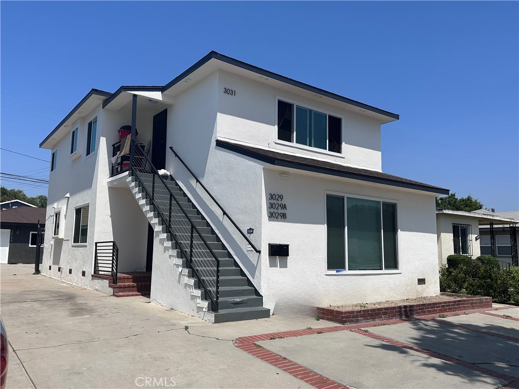 Turn-key 4-unit income property in the desirable northern section of Wrigley, Long Beach. 3029 Pacific Ave offers strong cash flow, updated interiors, and long-term upside. Located on a wide, tree-lined street just north of Willow, the property benefits from nearby amenities, larger lot homes, and higher owner occupancy. Excellent access to Pacific Hospital, Memorial Medical Center, Metro A Line (Wardlow & Willow stations), and Bus Line 182 makes this a prime location for tenant demand. Desirable unit mix: two spacious 2BR/1BA units + two newer 1BR/1BA ADUs (garage conversions with permits, completed in 2023). One ADU delivered vacant at COE—ideal for an owner-user or rent optimization. Downstairs 2BR was fully renovated in 2023 with in-unit laundry. Upstairs 2BR is in original condition with value-add potential. Coin-op laundry located just two doors down for tenant convenience. Uncovered parking, separate meters, and LBR2N zoning. Low-maintenance, stabilized asset with strong income. GSI: $101,808 | GRM: 13.5 | Cap Rate: 4.81%.