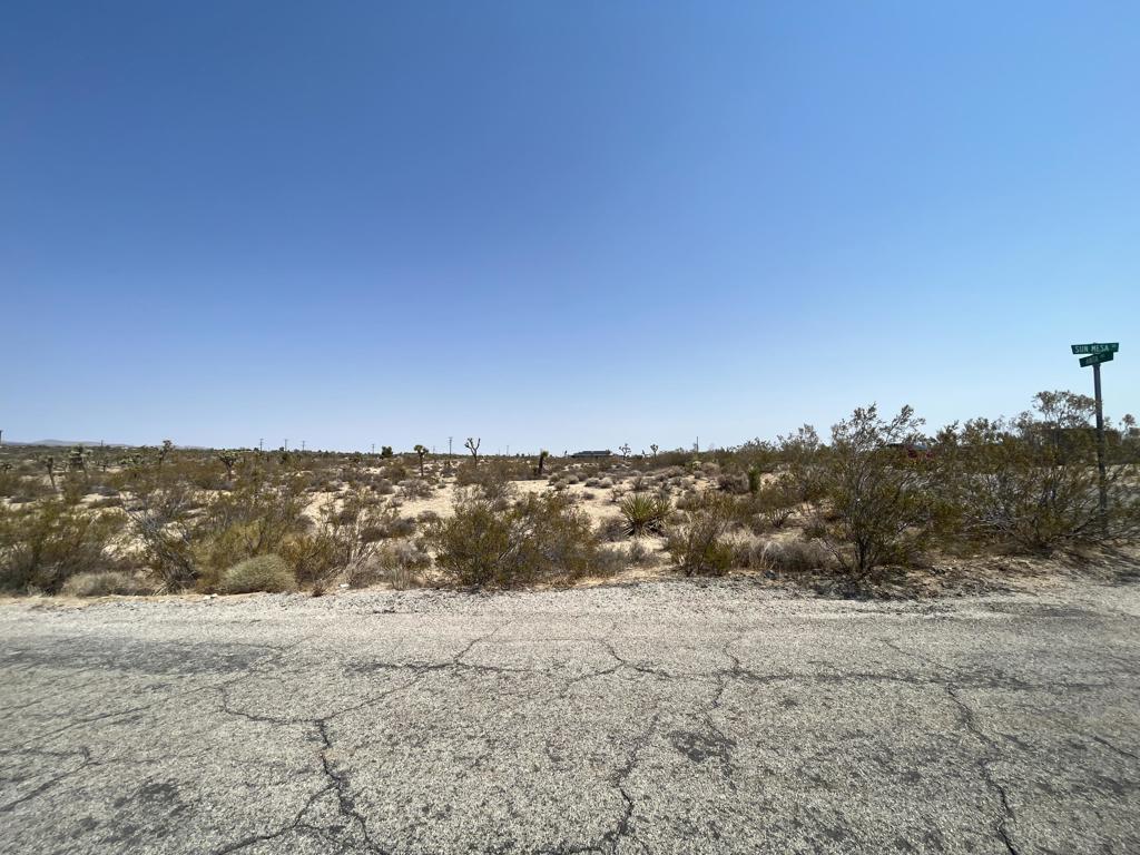 Prime 4.35-Acre Corner Lot in Booming Yucca Valley!Don't miss this rare opportunity to own a 4.35-acre corner lot on a paved road with water and power at the street. Located in a fast-growing neighborhood surrounded by new construction homes--many operating as high-performing short-term rentals--this property features multiple mature Joshua Trees and stunning mountain views. Just minutes from the Joshua Tree National Park entrance, it's the perfect spot to build your desert getaway or next investment property.