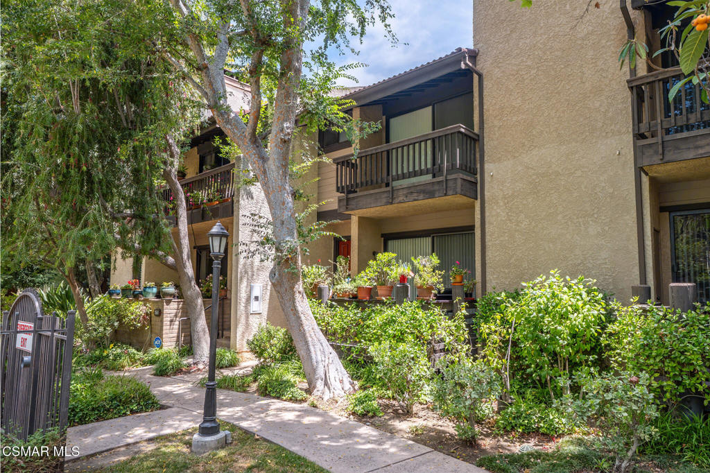 Nestled in the heart of Woodland Hills, this highly sought-after townhome offers stylishly remodeled features and spacious living across two huge bedrooms, plus bonus room, and two and a half bathrooms. The upstairs secondary bedroom is easily converted to two bedrooms. The bright, airy living room with soaring vaulted ceilings creates a serene atmosphere and opens to a charming patio overlooking one of the community's three sparkling pools.Open-concept dining area captures a chic urban vibe, perfect for entertaining. Adjacent is the completely renovated kitchen, featuring custom cabinetry, quartz countertops, and top-of-the-line Samsung and Bosch appliances. Enjoy peaceful mornings in the cozy eat-in breakfast nook, which opens to a delightful ''princess'' patio.Upstairs, the sunlit primary suite is a true retreat, complete with its own private balcony offering treetop views. The en-suite bathroom boasts a spacious double vanity, an oversized shower, and a walk-in closet--all beautifully updated. An additional large bedroom and a full bathroom complete the upper level.On the lower level, you'll find direct access from the attached garage into a versatile third room with a closet--perfect as a guest room, studio, office, or den.This move-in-ready townhome is peaceful and private, yet conveniently close to acclaimed restaurants, vibrant entertainment, and expansive parks. A perfect blend of comfort, style, and location. HOA includes: 3 community pools, 3 tennis courts, 2 racquet ball rooms, sauna, community room, and pretty creeks surrounded by lighted pathways.