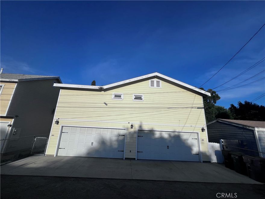 Newer unit for rent - This upstairs left unit at the back of the house features two bedrooms and two bathrooms, with a combined living room and kitchen. Access is through the back alley only. Refrigirator is included. Washer and dryer are under the stair.