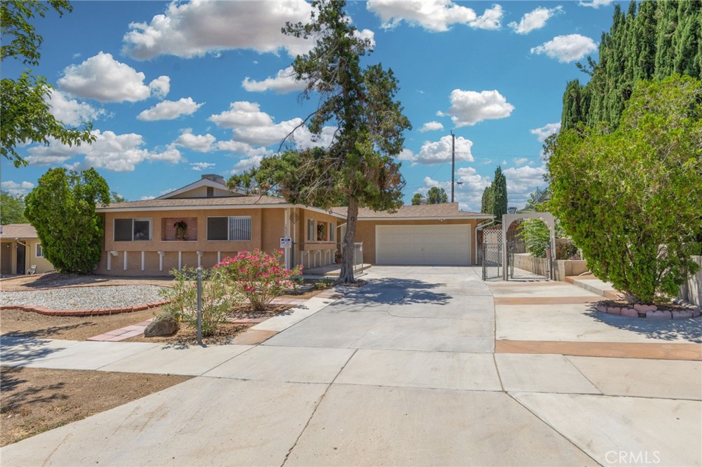 Welcome to 16257 Avalon Avenue – a charming and well-maintained home nestled in the heart of Victorville! This spacious 3-bedroom, 2-bathroom residence sits on a generous 7,800 sq. ft. lot and offers 1,577 sq. ft. of comfortable living space. Step inside to a warm and inviting living room featuring a cozy fireplace—perfect for relaxing evenings or entertaining guests. The home’s functional layout includes a bright kitchen, a dedicated dining area, and ample storage throughout. Enjoy added peace of mind and comfort with recently replaced sewer lines, upgraded electrical panels, and central A/C to keep you cool during those desert summers. Laundry hookups are conveniently located in the attached garage, adding to the home’s practicality. Whether you're a first-time buyer or looking to upgrade, this home offers the perfect blend of comfort, charm, and long-term value. Come experience the potential of this lovely Victorville gem!