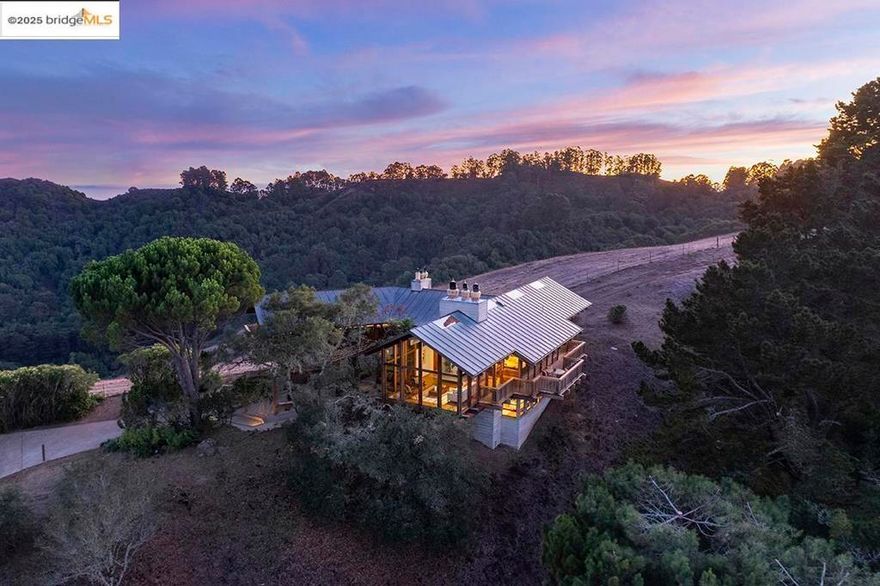 Inspired by the VanDamm house in Alfred Hitchcock’s North by Northwest, this architectural masterpiece offers jaw-dropping views and unparalleled seclusion and privacy within minutes of downtown Orinda and Berkeley and just steps to hiking trails. Designed and built by the owner for the owner this unique structure offers powerful angles, rugged materials, and a back to the earth vibe amidst a backdrop of nature in the masterful style of Frank Lloyd Wright. Massive beams meet at improbable angles, the living room and primary bedroom fully cantilever as if floating in space with floor to ceiling glass and views of Briones Reservoir, Mt Diablo, and EBMUD watershed. Hawks circle, turkeys gobble, and quail squabble in this magical retreat perched on its aerie at the top of the world. Featuring balconies off almost every room, 4 full bathrooms, large family room, quiet and gentle hydronic heating, separate built-in Subzero freezer and refrigerator, 60” gas range with 6 burners and 24” griddle, large garage and workshop space, almost all new lighting, new outlets/switches, gleaming oak floors, 22 new windows, 80 gallon Bradford White Heatpump water heater, and a new boiler.