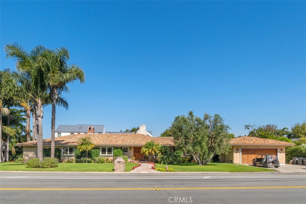 Welcome to the ultimate in coastal living and indoor-outdoor luxury in one of Newport Beach’s most coveted enclaves — the Cliffhaven neighborhood in the prestigious Newport Heights community. Situated on a sprawling 12,500+ sq ft lot, this 5-bedroom, 4.5-bath single-level estate features a rare combination of space, privacy, and resort-style amenities, including a tropical backyard retreat with pool, spa, and built-in BBQ—perfect for year-round entertaining.
This thoughtfully designed home includes two full primary suites, each with walk-in closets and beautifully appointed bathrooms—one featuring a soaking tub and walk-in shower. One of these primary suites is on the opposite wing of the house. This can be used as a private guest or in-law quarters, offering separation and flexibility for multi-generational living, guests, or work-from-home comfort. With over 3,600+ sq ft of single-level living space, you'll also enjoy luxury vinyl plank floors in the bedrooms and main living areas, a spacious formal living room, family room with wet bar, wine fridge, and wine rack.
The chef’s kitchen is equipped with top-tier appliances, including a Viking range, Sub-Zero refrigerator, stainless steel microwave and dishwasher, and a central island with breakfast bar seating—perfectly positioned to host and serve with ease. The home’s elongated driveway and 3-car garage offer both ample parking, storage and convenience, rounding out this truly exceptional property.
Step into the private, gated backyard oasis with lush landscaping, sparkling pool and jacuzzi, and abundant space for outdoor lounging, dining, and recreation. This is Southern California outdoor living at its finest.
Ideally located just minutes from Pacific Coast Highway, Newport Harbor, and the beach, this home is also close to the boutiques and restaurants of 17th Street, top-rated schools, and within a short drive of John Wayne Airport (SNA) for easy access anywhere. Whether you're seeking a private sanctuary or an entertainer’s dream, this single-level Cliffhaven gem delivers it all.