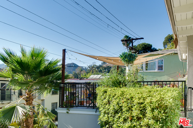 This charming mid-century duplex nestled in the Hollywood Dell is set above the street on a wide lot with peaceful views of the Hollywood Hills. Voted one of the "10 Best Neighborhoods You've Never Heard Of" by Los Angeles Magazine, the Hollywood Dell is one of LA's treasured enclaves. Side by Side units boast classic mid-century architecture with vaulted tongue and groove ceilings, hardwood floors and an open floor plans. Each unit feels like a home and is a private oasis with its own huge front deck as well as a separate garden area in the rear. 2 BD/1 BATH each, original details w/updated systems, central heat/air, and finished with a unique flair - one modern, one vintage. The modern unit has Miele, Bosch & Kitchen Aid appliances, the Vintage unit boasts an O'Keefe & Merritt stove. Conveniently located near shops, restaurants, studios & transportation. Truly a fabulous ownership opportunity!