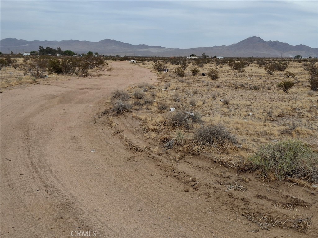 Escape the city and embrace the open skies on this spacious 2.5-acre lot just north of Adelanto. Zoned RL-5, this parcel offers a variety of options—ideal for a custom home, weekend retreat, agriculture, or recreational use (buyer to verify).
Enjoy peaceful desert views, stunning sunrises, and star-filled nights. The area is perfect for outdoor enthusiasts—bring your off-road toys, set up a private camping space, or create your own desert oasis. Close enough to local amenities but far enough for that private, off-grid feel. Approximate coordinates: 34.63927, -117.42115.
