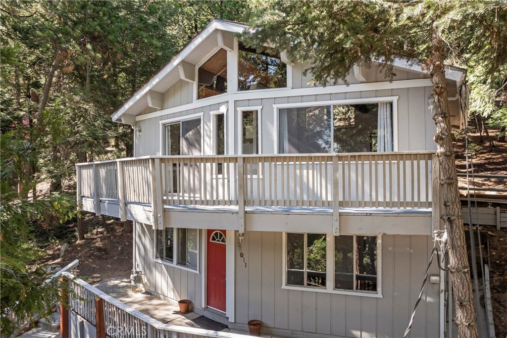 Tranquil Forest Retreat on Expansive 19,000 Sq Ft Lot. Tucked away among towering pines and lush natural landscaping, this serene mountain retreat offers the perfect blend of privacy, space, and scenic beauty. Set on a sprawling 19,000 square foot lot, the home is surrounded by a canopy of mature trees that create a peaceful, park-like setting, ideal for those seeking refuge from the hustle and bustle of everyday life.
Step inside to a bright and airy living room where oversized windows frame breathtaking views of the surrounding forest. Natural light pours in, illuminating the spacious open layout and creating a seamless connection between indoor comfort and the stunning outdoor scenery. A cozy wood-burning fireplace serves as the heart of the home, perfect for cool mountain evenings.
Whether you're sipping your morning coffee on the deck, watching wildlife wander through the trees, or entertaining guests under the stars, this property invites you to experience nature to its fullest. Conveniently located just minutes from charming downtown Crestline and the sparkling waters of Lake Gregory, you’ll enjoy year-round recreation, from hiking and fishing to shopping and lakeside summer fun—all just moments from your doorstep. This one-of-a-kind property is a rare opportunity to own a slice of mountain paradise.