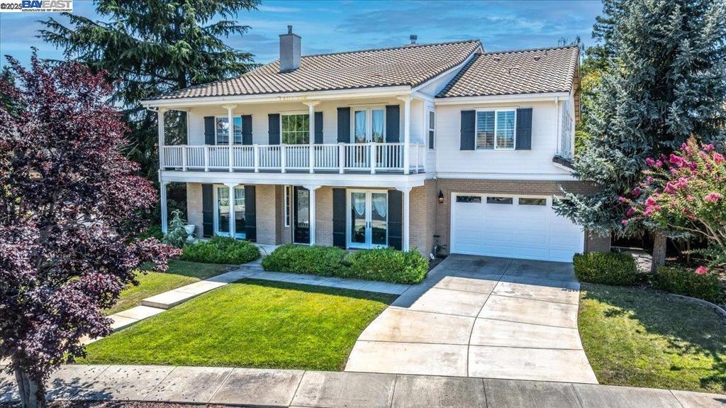 Welcome to this northeast facing South Livermore home located in the heart of the South Livermore Valley! Bright and open entry leads to living room with high ceilings and large formal dining room with double sided gas fireplace. There is a bedroom and full bath plus half bath downstairs. The kitchen has expansive counter space and is highly upgraded with slab granite counters with tumbled marble trim in the back splash, large center island, , stainless steel kitchen aid appliances including built-in refrigerator and loads of cabinet and pantry space. The sunny breakfast nook and kitchen are open to the spacious family room with raised hearth with marble finish. Upstairs are 4 bedrooms plus bonus room with access to large balcony. The master suite has large his and hers closet, master bath with marble tile finish and separate jetted tub. Upgrades include plantation shutters, surround sound in the family room, and crown molding. The backyard is private and has shaded areas plus spacious lawn for kids to play or future pool. Dont miss this rare opportunity to own a well appointed home located in the heart of the South Livermore Valley.