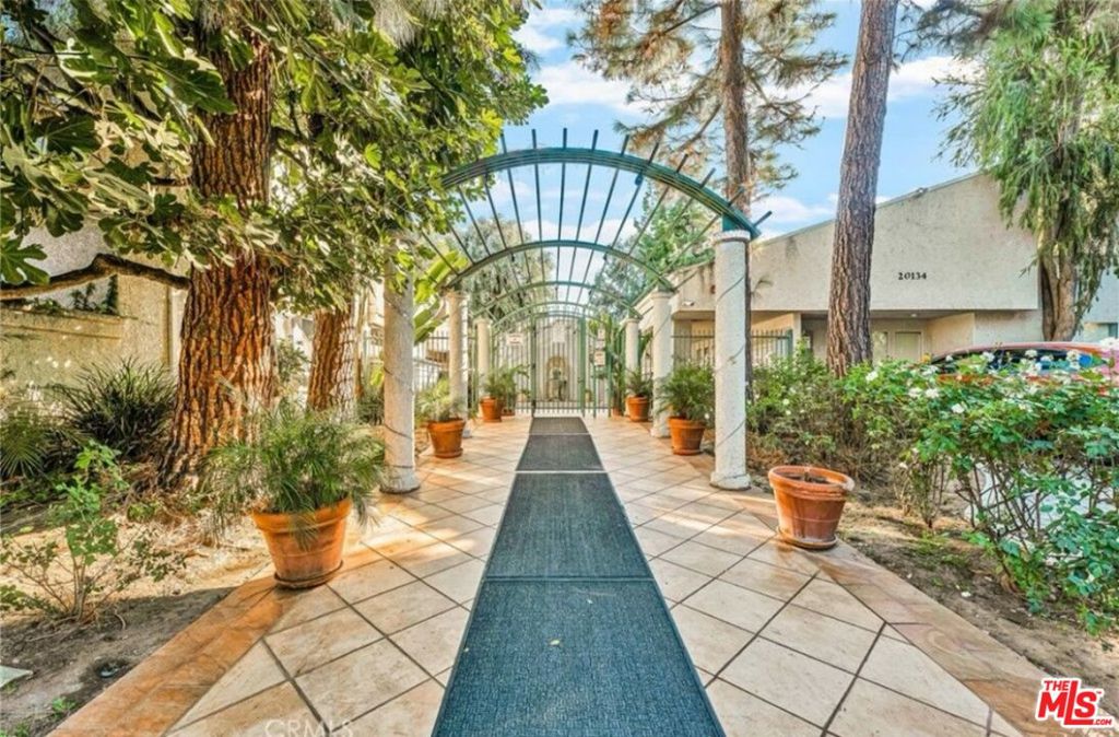 Spacious 2-Bedroom, 2-Bath First-Floor Condo Surrounded by Lush Landscaping. Welcome to this well-appointed first-floor unit tucked away in a beautifully maintained community full of greenery and charm. This bright and spacious 2-bedroom, 2-bathroom home features easy-care laminate flooring and an open layout that feels both comfortable and inviting. The community offers great amenities including swimming pools, two relaxing Jacuzzis, a clubhouse/recreation room, and one covered parking space. It's centrally located with easy access to everything you need shopping, dining, and more. Whether you're kicking back at home or taking a stroll through the landscaped grounds, this place offers a great mix of comfort, convenience, and laid-back living.