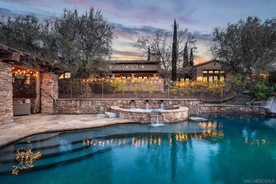 This exceptional 8-bed, 8-bath estate is the ultimate family compound in the guard-gated community of Santaluz. Designed with one of the most desirable open floor plans, it offers seamless indoor-outdoor living. Two private casitas provide space for visitors, while a vineyard and fruit trees create a serene retreat. The resort-style pool and spa make it perfect for entertaining. This home also features paid solar, ensuring energy efficiency and lower utility costs. Residents have the opportunity to join The Santaluz Club, which offers a private championship golf course, luxurious spa services, fine dining, and a variety of recreational activities for all ages. A perfect blend of elegance, comfort, and resort-style living.