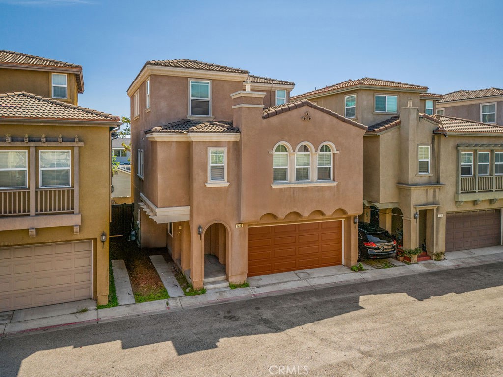 Beautiful 3 Story Townhome in a Private Gated Community! Welcome to this wonderful 3 bedroom, 4 bathroom townhouse offering 2,252 sq ft of comfortable living space, nestled in a private and secure gated community. This home combines style, functionality, and a fantastic location. Step inside to find laminate flooring throughout the main living areas, tile in the bathrooms, and carpet in all bedrooms. The first floor features a private bedroom and full bath—perfect for guests, in-laws, or a home office setup. The heart of the home is the open concept kitchen, complete with recessed lighting, ample cabinet space, bar seating, and a built-in desk area. Appliances include a refrigerator, stove, microwave, and dishwasher. Custom shutters accent the kitchen windows, bringing in natural light while offering privacy. The dining area is adjacent to the spacious living room, where large windows and a cozy fireplace create an inviting atmosphere. All bedrooms are generously sized and equipped with ceiling fans for year round comfort. The second floor laundry room comes fully equipped with a washer and dryer for added convenience. Central AC and heating ensure the perfect indoor climate throughout the seasons. Enjoy the outdoors in your low-maintenance backyard, featuring a peaceful waterfall fountain—ideal for relaxing or entertaining. The 2 car attached garage provides direct access and additional storage. Located just minutes from major freeways including the 110, 405, and 91, commuting is a breeze. You’ll also be close to premier shopping at South Bay Galleria, a wide selection of restaurants, and nearby golf courses. Don’t miss the opportunity to make this beautiful townhome your own!