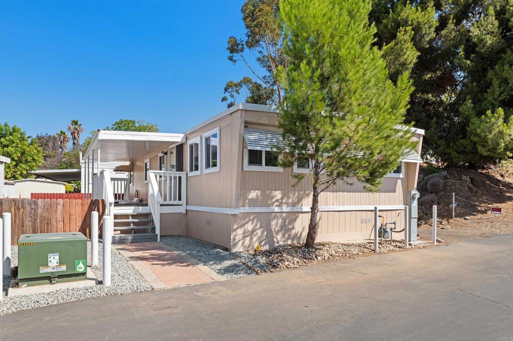 Fully Remodeled 3-Bed, 2-Bath Gem in a Great Family Park! Welcome home! This beautifully remodeled 3-bedroom, 2-bath home may have been built in 1974, but it has a brand new 2025 look and feel—modern, fresh, and move-in ready! From the moment you arrive, you’ll notice the freshly painted exterior and charming gated front yard, perfect for your furry friends. Step inside and be instantly impressed by the top-to-bottom renovations: new dual-pane windows, stylish flooring, fresh paint, recessed lighting, and a clean, open-concept layout that feels both warm and contemporary. The kitchen is a true standout, featuring new cabinetry, a sleek stove, microwave, and dishwasher—ideal for cooking and entertaining with ease. Both bathrooms have been completely reimagined with designer touches. The hall bath includes a chic light fixture and modern finishes, while the primary suite boasts a stunning en-suite bath with a beautifully tiled shower. Additional highlights include a two-car attached carport and a private storage shed for all your extras. Located in a well-kept, family-friendly park, this home blends timeless charm with modern upgrades. Don’t miss your chance to make it yours!