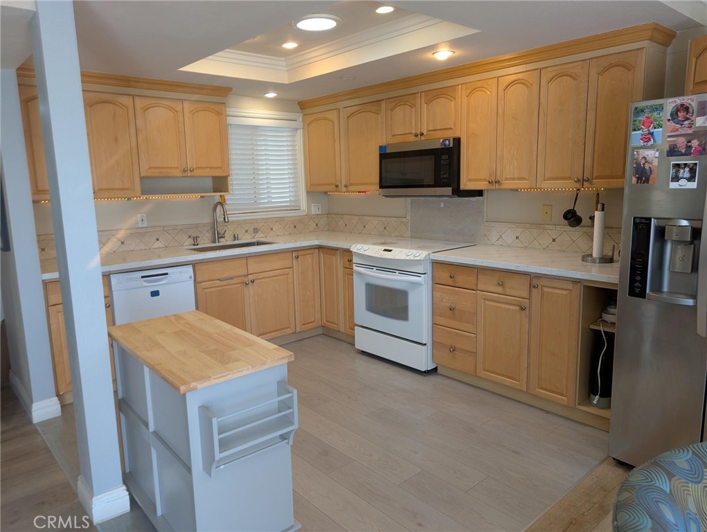 This tastefully updated top-floor condo offers spectacular hilltop views and an abundance of natural light. With just eight steps to the front door and no neighbors above, you'll enjoy a peaceful, quiet living environment.
The home faces east, providing beautiful morning sunlight to start your day. The modern, open-concept kitchen features brand new quartz countertops, blending style and functionality. Each bedroom is equipped with its own A/C unit for personalized comfort year-round. A private in-unit laundry provides added convenience, making daily living even more comfortable. As a top-floor unit, you'll also appreciate the added privacy and quiet with no overhead foot traffic.
Freshly updated throughout and move-in ready, this bright and serene home is ideal for those seeking a tranquil setting with contemporary upgrades and panoramic views.
Located in the vibrant 55+ community of Laguna Woods, you'll enjoy access to world-class amenities including seven clubhouses, five swimming pools, tennis and pickleball courts, two fitness centers, a championship golf course, hundreds of social clubs, and miles of scenic walking and biking trails. Experience resort-style living in one of Orange County's most desirable active adult communities.