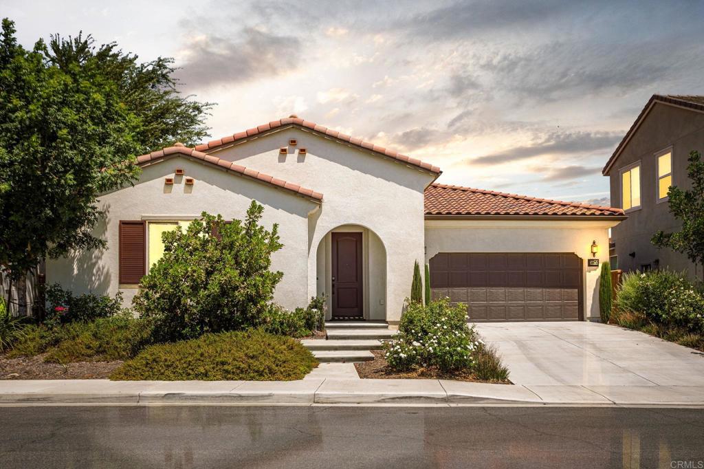 Imagine walking into a model home and falling in love, only to realize the base model just isn’t the same. This Is Your Opportunity To Own That Actual Model Home! Welcome to 30674 Nature Road, located in the highly desirable Agave neighborhood at Spencer’s Crossing. This barely lived-in, single-story home offers 4 bedrooms and 2 1/2 bathroom across 3,066 square feet, with every upgrade you could want. Inside, the open floor plan features taller ceilings, designer lighting, and upgraded flooring throughout. The home includes smart home technology that can control lighting, door locks, garage door, thermostat, alarm system, and even the window shades! The gourmet kitchen is a chef’s dream with Quartz countertops, elegant soft close cabinetry that includes clear glass upper cabinets, 5 burner double oven stove, walk-in pantry, and under-cabinet lighting. The spacious living area includes a beautiful fireplace and extended double sliding doors that open to the covered concrete patio that comes complete with lighting and built-in speakers for year-round entertaining. The luxurious primary suite offers a spa-inspired bath with dual vanities, soaking tub, and frameless glass shower. Secondary bedrooms are generously sized with upgraded lighting and closet features. Additional highlights include crown molding, Cat 6 internet wiring, whole-home audio, energy-efficient windows, tankless water heater with recirculation pump, solar panels, and a 2-car garage with a universal EV charging port. Spencer’s Crossing residents enjoy resort-style amenities including pools, parks, sports fields, trails, and top-rated schools. This is the perfect blend of elegance, upgrades, and lifestyle...all in one move-in ready home.