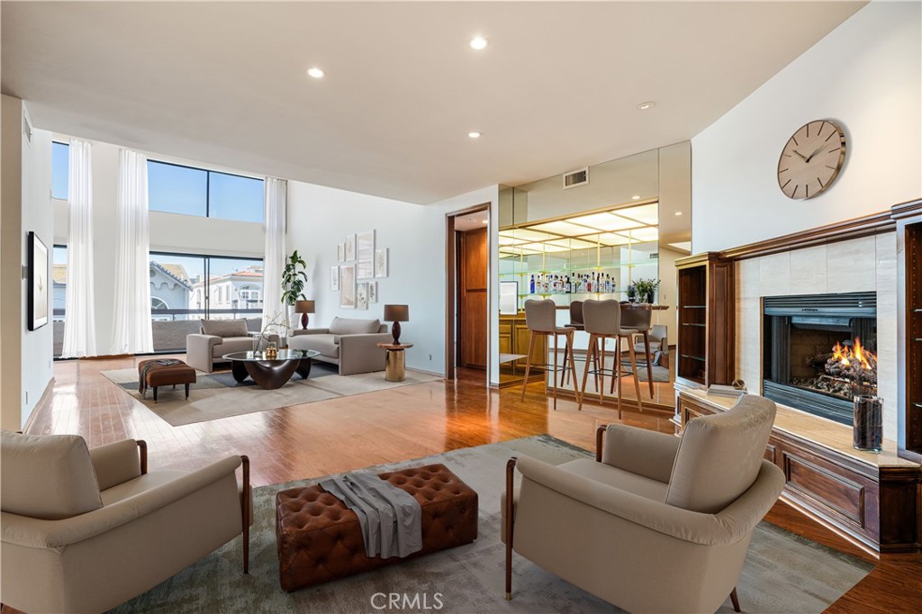 Discover unparalleled luxury in this front-facing penthouse, where style and comfort converge. Boasting soaring ceilings nearly 18 feet high, this residence is awash in natural light, creating an inviting ambiance.The first floor features two beautifully designed bedrooms, including a spacious primary suite, strategically separated by a generous living area. Entertain effortlessly in the elegant dining space or the eat-in kitchen, which flows into the grand living room, complete with a charming fireplace and wet bar, ideal for hosting gatherings. The upper level offers a versatile loft that can be transformed into a third bedroom, complete with a closet and a full bathroom, providing additional flexibility and privacy. Step outside to enjoy exceptional outdoor living on a massive private deck, perfect for lounging or entertaining, alongside an additional shared rooftop deck that showcases stunning views.This is more than just a lease; it’s an opportunity to elevate your lifestyle. Don’t miss out on making this extraordinary space your new home!
This penthouse is equipped with a newer HVAC unit for year-round comfort. Residents will also benefit from a range of building amenities, including a refreshing pool, rejuvenating spa, and serene sauna. For added convenience, two side-by-side parking spaces are included.