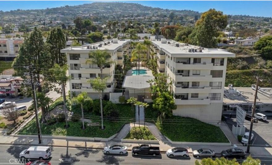 Welcome to this beautifully remodeled, light-filled condo that blends spacious living with modern upgrades and a prime location.



From the moment you step inside, you’re greeted with serene views of the pool and the lush greenery of Peck Park—setting the tone for a home that feels open, peaceful, and connected to nature.



The living room is the heart of the home: expansive and inviting, with room for multiple seating areas. Just off the main space is a private office nook, perfectly tucked away for working from home, reading, or hobbies. Large windows bathe the interiors in natural light, creating a warm and welcoming atmosphere throughout the day.



An open dining area flows seamlessly to the generous balcony—ideal for morning coffee, al fresco dining, or simply relaxing with views of the sparkling pool and manicured community grounds.



The remodeled kitchen features sleek new countertops, contemporary finishes, and ample cabinetry, including convenient container-holder drawers. All drawers are designed with silent-glide technology for a smooth, quiet close. A washer/dryer combo in the hallway closet adds everyday convenience without sacrificing space.



The primary suite offers a private retreat with its own ensuite bathroom, while the second bedroom is equally spacious and served by a fully remodeled bath complete with a tub—perfect for guests or family.



The location is hard to beat: Peck Park, with walking trails, playgrounds, and wide-open green space, is just steps away. Shopping, dining, and daily essentials are within walking distance, giving you comfort and convenience at your doorstep.



With light-filled interiors, modern touches, and a lifestyle centered around both comfort and community, this condo is a place you’ll love to call home.