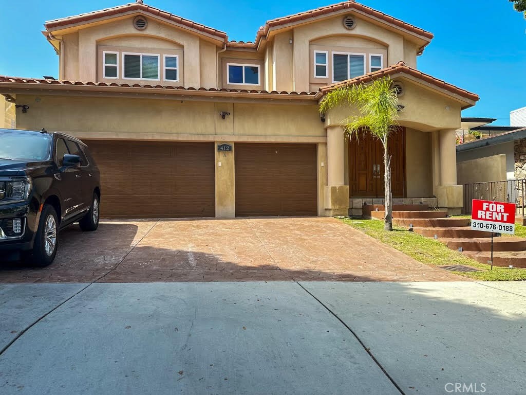 Just minutes from the shoreline and the vibrant Hollywood Riviera, this 4-bedroom, 3-bath home offers a versatile floor plan designed for both comfort and productivity. Beautiful wooden floors flow throughout, highlighted by a wide staircase that connects both levels. The main floor includes two bedrooms and a full bath, with one bedroom perfectly suited for a private office or guest space. Upstairs, additional bedrooms and baths provide privacy for family and guests. Additional features include an in-home laundry room, a one-car garage with an extra parking space, and an electric vehicle charging outlet inside the garage.