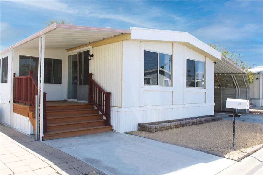 YOU OWN THE LAND. There is NO SPACE RENT OR LAND LEASE. 
Welcome to this updated 2-bedroom, 2-bathroom home, nestled in a highly desired and vibrant 55+ community. This home has a carport and a second large side for additional cars or storage.
This home offers an open floor plan, seamlessly connecting the dining and living areas. It boasts a light-filled sun room along with a private patio deck area. The kitchen features brand-new appliances. No rear neighbors! 

Community Amenities Include: 3 well maintained pools, Relaxing spa, Clubhouse with various social and recreational activities, Fully equipped gym, Sauna, Billiards room and library. This community is not only a fantastic place to live, it is a great place to thrive and enjoy an active, social lifestyle. There is NO SPACE RENT OR LAND LEASE! Call today to schedule a private tour!