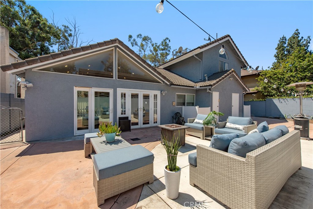 Welcome to this beautifully upgraded and spacious home which offering a bright & open floor plan especially designed for comfort and convenience. It features total 4 Bedrooms, 3.5 baths, 2-car garage, and approximately 2,642 sq. ft. living space.The expansive Living Room features vaulted ceilings, recessed lighting, and a cozy fireplace I, creating the perfect space for relaxing or entertaining. The chef-inspired Kitchen is the heart of the home, boasting a massive Caesarstone center island, ideal for cooking, gathering, and hosting. On the first level, you’ll find a "small" Primary ensuite Bedroom, two additional bedrooms, a hallway bathroom and a powder room by foyer/entryway. The second level showcases a luxurious "grand" Primary Suite which is a permitted 1,200 sq. ft. addition completed in 1988 featuring its own fireplace II, his and her walk-in closets, a spa-like bathroom with a soaking tub, separate shower, toilet room, retreat area and impressive dual-sink vanity. Modern upgrades include dual central AC units with Nest thermostats, dual furnaces, newer ductwork, re-piped PEX and copper plumbing, and a 200-amp electrical panel upgrade. The home also offers freshly painted exteriors, double-paned windows throughout, and a 2-car garage with MyQ remote-controlled doors, laundry hookups, and a convenient laundry chute from upstairs. Step outside to the backyard retreat, complete with a built-in BBQ grill for outdoor dining and gatherings. Ideally located near shopping, restaurants, parks, Cerritos College, top-rated ABC schools including Whitney High eligibility, and with easy freeway access. This extraordinary home combines comfort, functionality, and seclusive location. The community is also supported by a neighborhood watch program with security cameras and residents connection via WhatsApp. Most interior upgrades were thoughtfully completed in 2014, making this a move-in ready home with timeless appeal. Must see to appreciate it!!