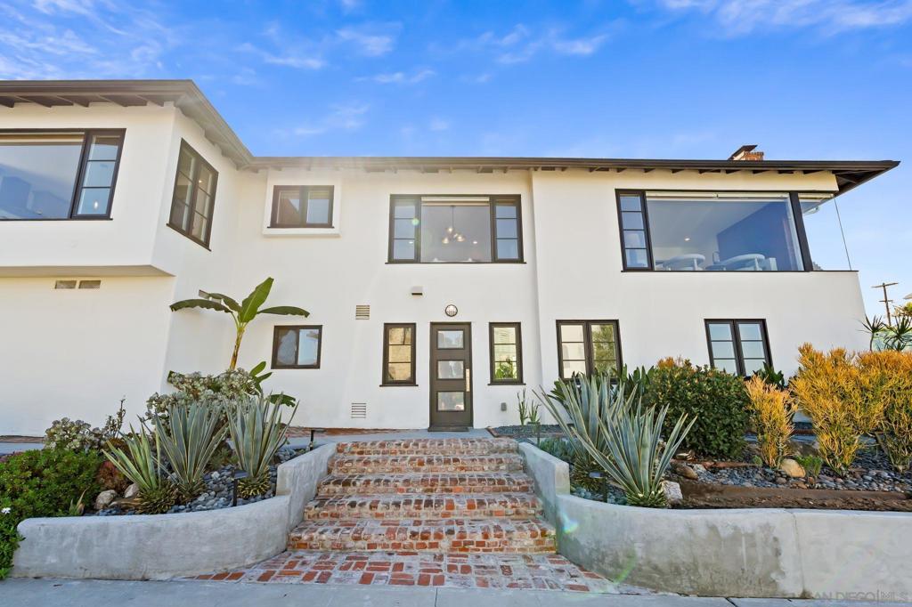 WELCOME TO YOUR NEW REMODELED HOME that is elegantly situated on the scenic hills of Point Loma, this radiant mid-century corner lot home captures the essence of sophisticated living with A new wood deck that captures San Diego’s finest bay views then step inside to find large windows that artfully frame sweeping cityscapes, shimmering water views and distant mountain vistas. The interiors are adorned with luxurious modern finishes, featuring a chef’s kitchen equipped with professional-grade appliances, a chef’s range, a wall-mounted pot filler, double oven and an expansive island—perfectly designed for entertaining. Thoughtfully appointed with central air and heating, an impressive wine cellar, a NEW principal Bedroom designed with a double sink & marble tile. Followed by a NEW powder room addition designed with Mable floors & wainscoted walls. The laundry room is conveniently located and there is a Tesla charging station within the impeccably finished epoxy-coated 3-car garage, every detail has been meticulously crafted for elevated living. Seamlessly blending indoor and outdoor living, this home offers a drought-tolerant yard, beautifully complemented by a rooftop deck that invites relaxation and endless enjoyment of the breathtaking views. The elegantly remodeled bathrooms showcase designer finishes and timeless tilework, exuding a sense of luxury. The lower level of this BEAUTIFUL home presents a cozy family room, bedroom/office, complete with its own entrance, with the potential for an ADU over the garage and a yard large enough for a pool!