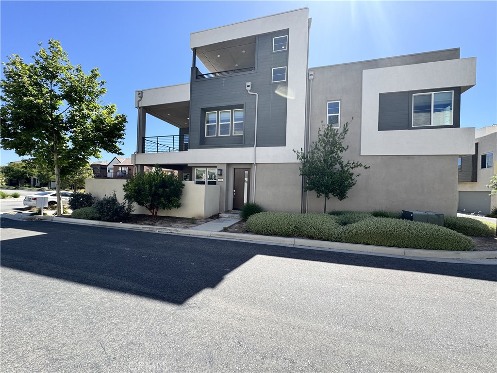 Stunning Detached Corner Lot Home with a View and a backyard! This spacious three-story home features three large bedrooms with large windows, two and a half bathrooms, an airy loft space, a third floor bonus room, and a two-bay garage. Enter into the dedicated dining room, which seamlessly opens into the family room and gourmet kitchen featuring large center island and walk-in pantry. Sliding glass doors off the dining room give access to a lovely California Room paved with new hardwood floors. The second floor offers two secondary bedrooms, a full bath, fun loft space for multiple uses, and laundry room. Off the loft is the spacious owner's suite and en suite bathroom showcasing an over sized walk-in closet with shoe rack, walk-in shower, separate soaking tub, and double sinks. On the third floor, a flexible bonus room lends itself for in-home office or entertaining with the covered deck and built-in cabinetry with included under counter beverage center. There is a large deck on each of the second and third floors. Zoned for top-rated Irvine Unified Schools, this almost new home offers the perfect blend of style, comfort, and convenience and includes access to all of the wonderful amenities that the Great Park Neighborhoods have to offer such as pools, playgrounds, BBQs, clubhouses and more. 5 minutes’ walk to the Olympic length swimming pool and 200 yards to Great Park. Walking distance to K-12 schools. Short drive distance to Irvine Spectrum Shopping Center. Ample guest parking spaces off the street.