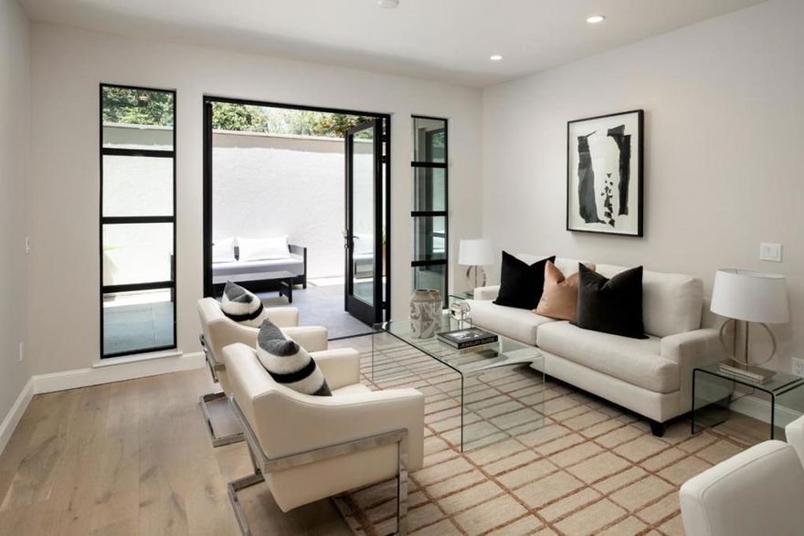 Traditional Parking Spaces in these Brand New Luxury Condos! Discover refined main-level living in this exclusive 2/2 residence featuring a desirable split floor plan w/bedrooms flanking the central living, dining, & kitchen area designed for both privacy & effortless entertaining. Situated in a boutique 27-residence building across 4 levels, Unit 107 exemplifies refined design & modern comfort. Enjoy an open-concept layout w/ soaring ceilings, European oak engineered wood flooring, Nest thermostats, & a stunning Bianco Carrara waterfall island. The chefs kitchen is equipped w/ premium Thermador appliances & custom cabinetry. A spacious patio invites seamless indoor-outdoor living & natural light throughout the day. Additional highlights include 2 dedicated parking spaces in the secured 2-level underground garage w/ Klaus car stackers, EV-ready infrastructure, & private storage. Residents enjoy access to a rooftop terrace w/ lounge seating, fire pit, & BBQ perfect for relaxing or entertaining under the California sky. Live the ultimate lock-and-leave lifestyle in one of Silicon Valley's most coveted downtowns. Just blocks from top-rated LASD, vibrant dining, Draeger's Market, parks, & boutique shopping. Moments from leading tech campuses!